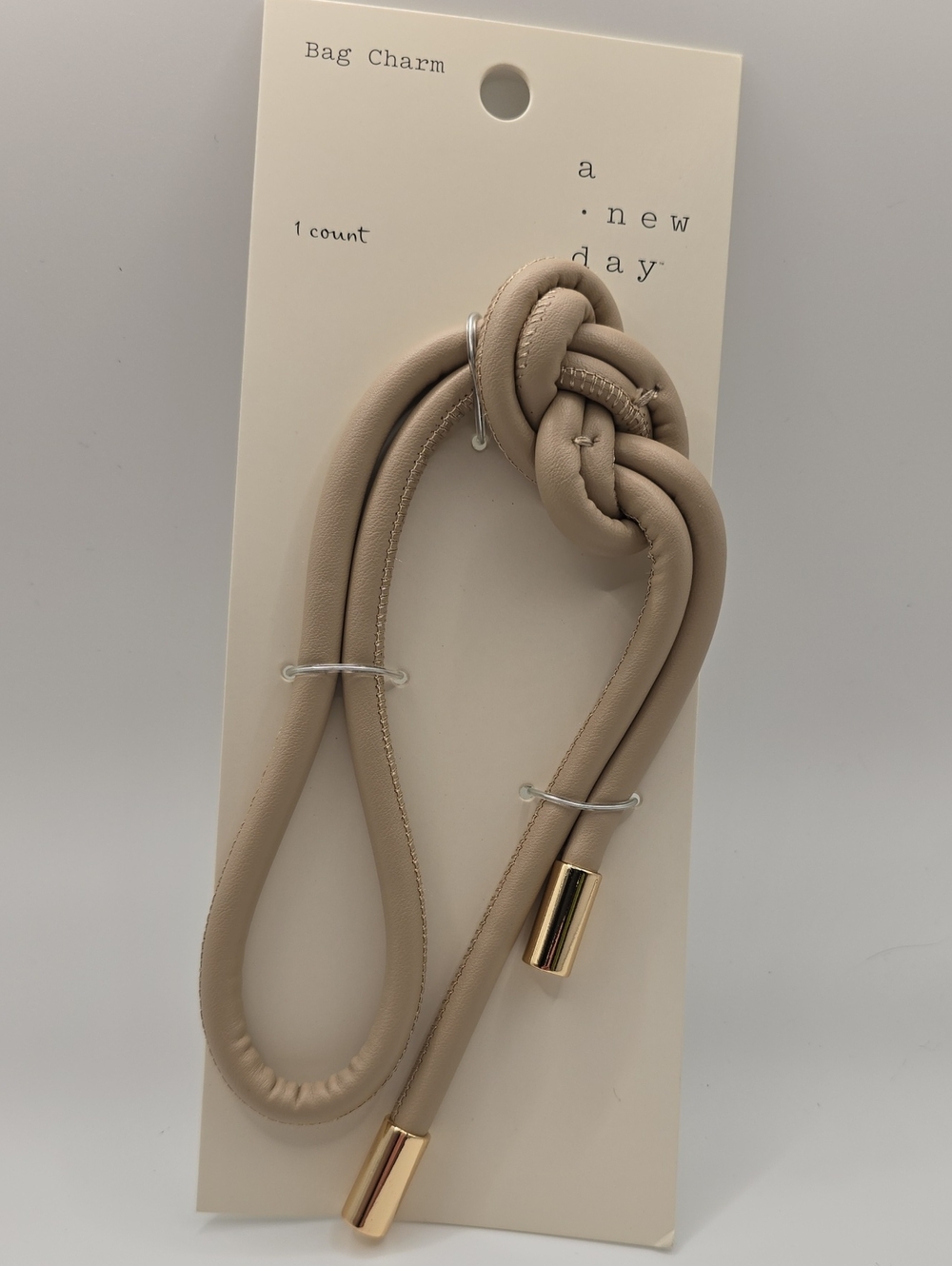 a new day Beige Knot Bracelet Bag Charm with Gold Accents